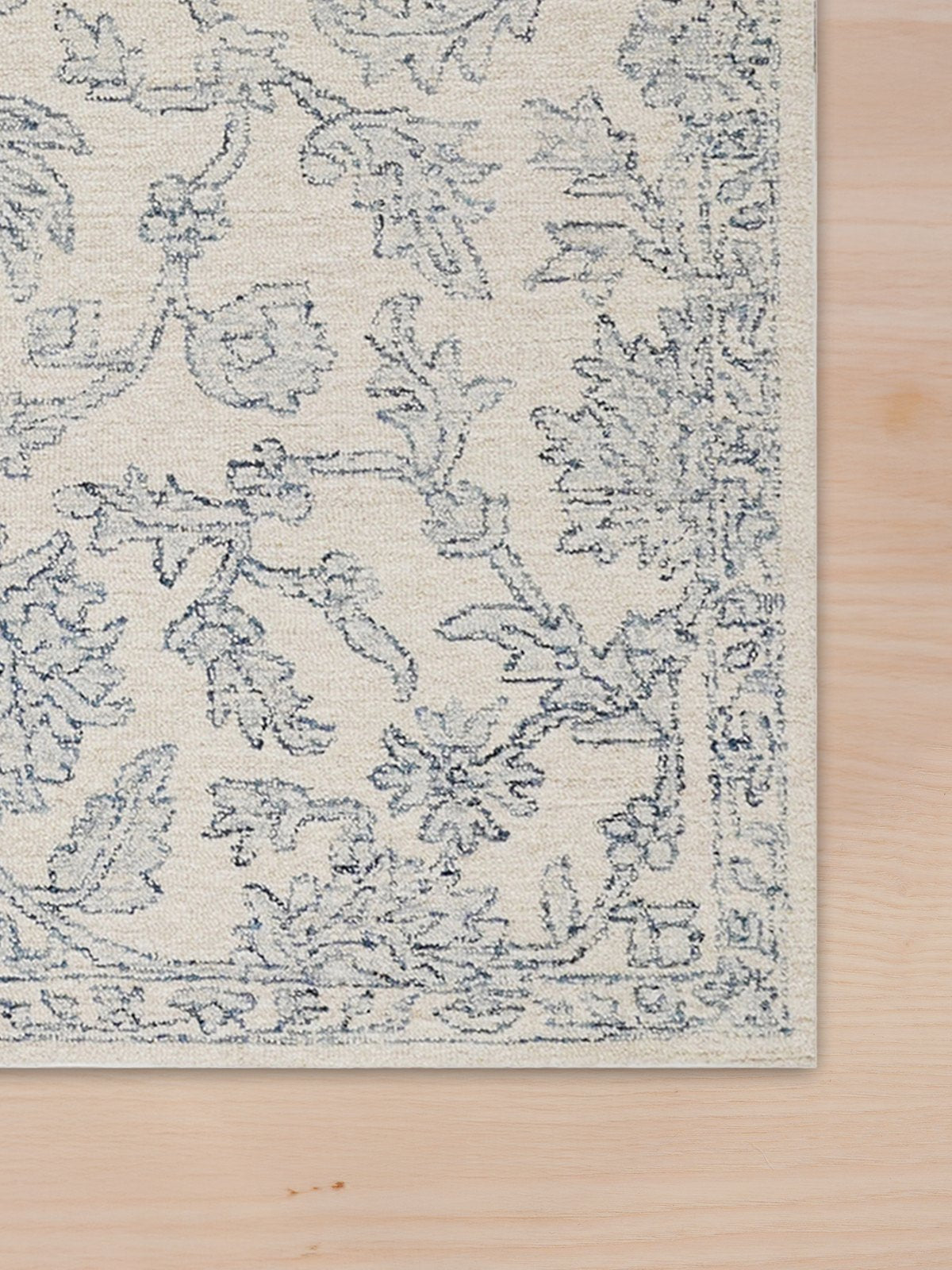 Close-up of a hand-knotted wool rug showing the weave and border detail