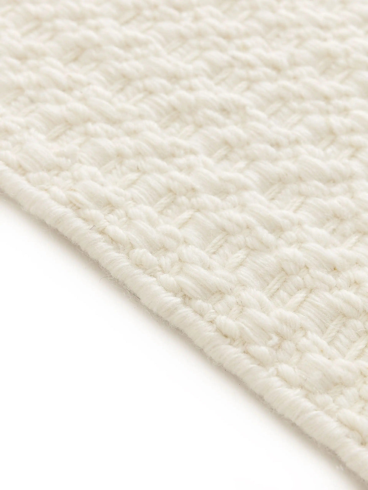 Handwoven wool rug texture